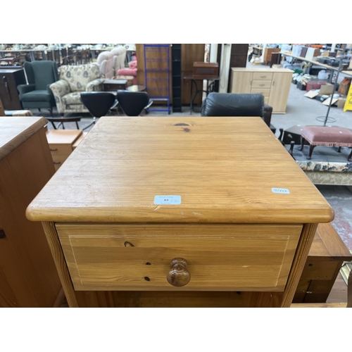 89 - A pair of pine bedside cabinets - approx. 61cm high x 44cm wide x 41cm deep