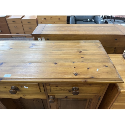 90 - A Victorian style pine sideboard - approx. 90cm high x 130cm wide x 46cm deep