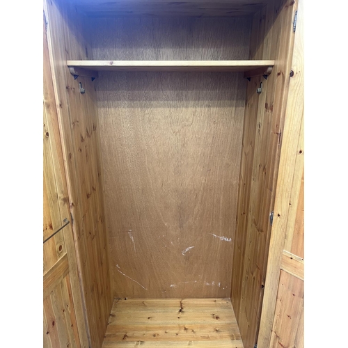 94 - A pine double wardrobe - approx. 190cm high x 92cm wide x 57cm deep