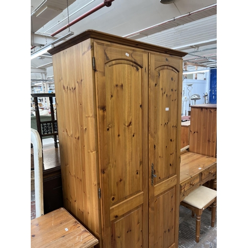 94 - A pine double wardrobe - approx. 190cm high x 92cm wide x 57cm deep