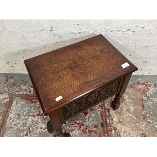 98 - A 17th century style carved oak sewing box with grapevine design - approx. 47cm high x 49cm wide x 3... 