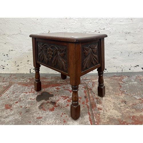 98 - A 17th century style carved oak sewing box with grapevine design - approx. 47cm high x 49cm wide x 3... 