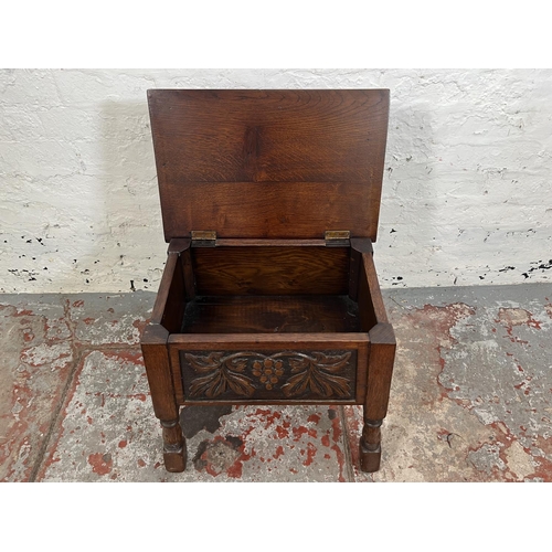 98 - A 17th century style carved oak sewing box with grapevine design - approx. 47cm high x 49cm wide x 3... 