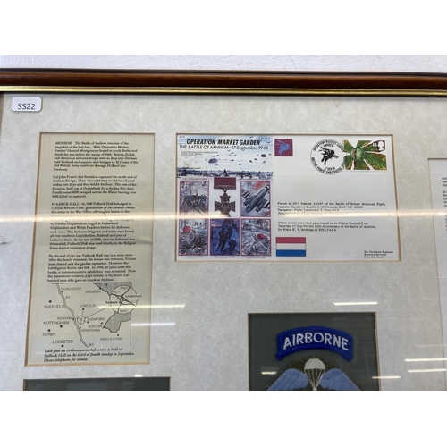 481 - A framed Battle of Arnhem memorial presentation board with 1944-1994 cloth patch, first day cover et... 