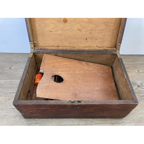 515 - A 19th century stained pine rectangular box containing a collection of vintage artist's equipment to... 