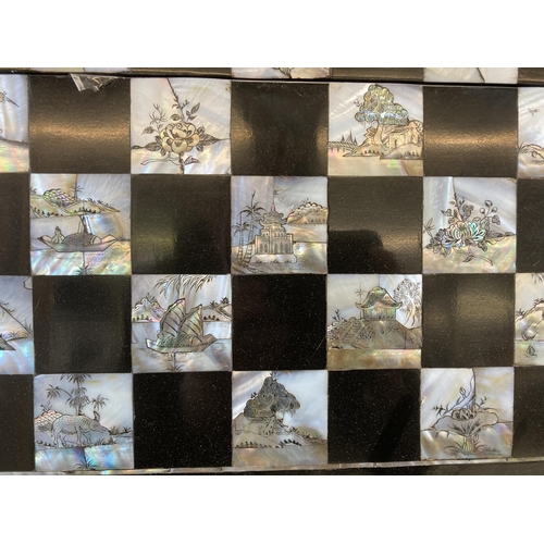 517 - A vintage Japanese black lacquered and mother of pearl inlaid folding travelling chess board - appro... 