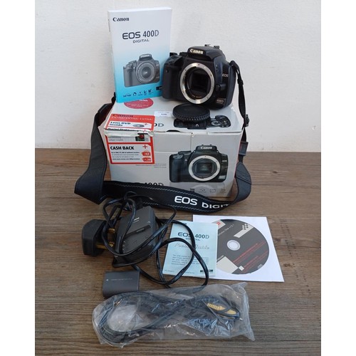 539 - A boxed Canon EOS 400D 10.1mp DSLR camera body with charger, battery, cable, instruction manual and ... 