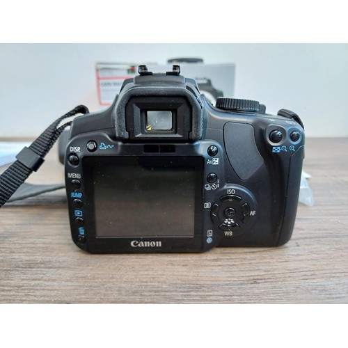 539 - A boxed Canon EOS 400D 10.1mp DSLR camera body with charger, battery, cable, instruction manual and ... 