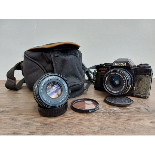 541 - A camera case containing 1980s Ricoh KR-10 Super 35mm SLR camera fitted with Pentax-M 1:2.8 28mm len... 