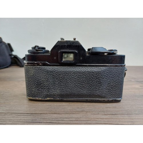 541 - A camera case containing 1980s Ricoh KR-10 Super 35mm SLR camera fitted with Pentax-M 1:2.8 28mm len... 