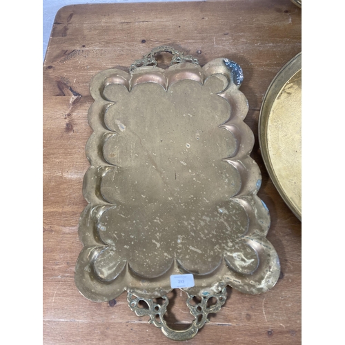 293 - Five vintage Middle Eastern brass serving trays - largest approx. 62cm diameter