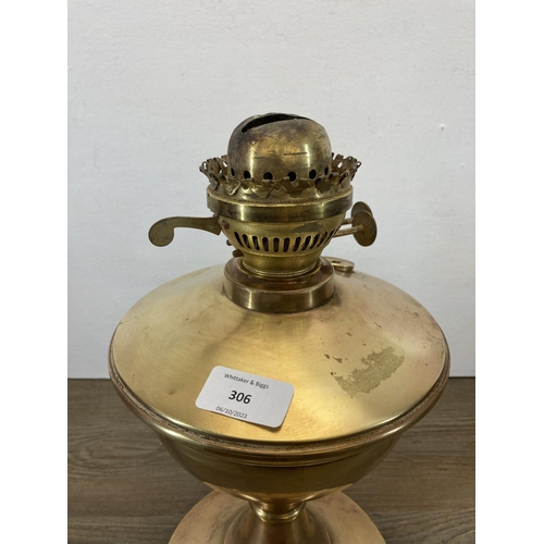 306 - A 19th century brass oil lamp - approx. 33cm high