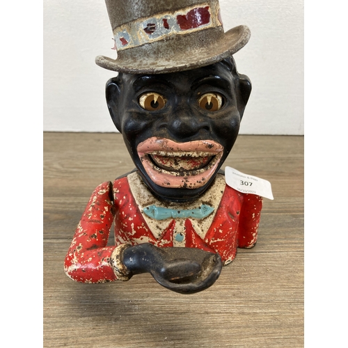 307 - A vintage novelty cast iron money box with top hat