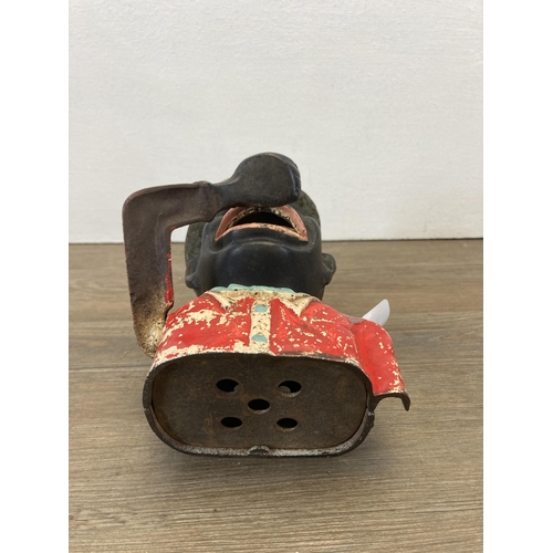 307 - A vintage novelty cast iron money box with top hat