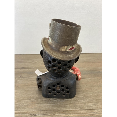 307 - A vintage novelty cast iron money box with top hat