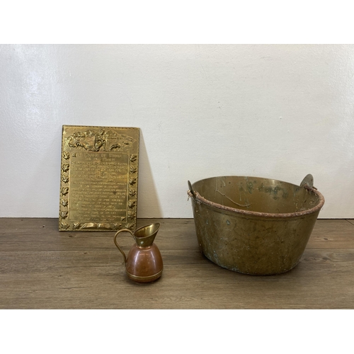 312 - A collection of metalware to include 19th century brass preserve pan, two embossed wall plaques, vin... 