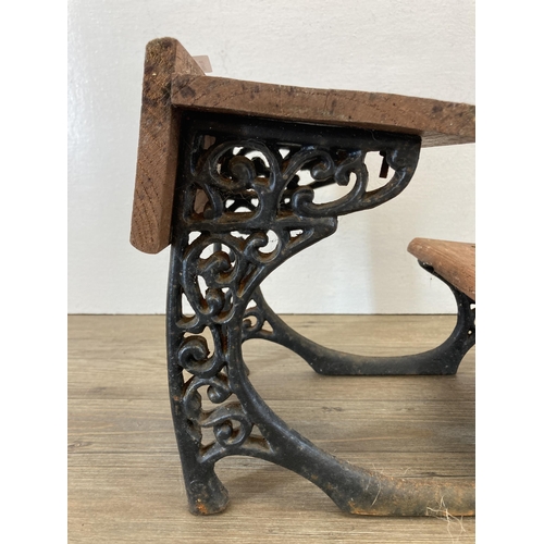 314 - A 19th century style cast iron and wooden model of a school desk - approx. 23cm high x 27cm long x 2... 