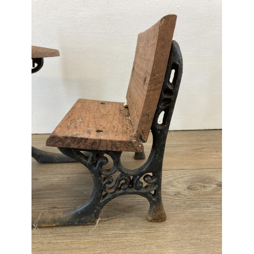 314 - A 19th century style cast iron and wooden model of a school desk - approx. 23cm high x 27cm long x 2... 