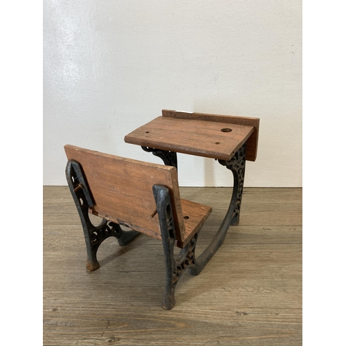 314 - A 19th century style cast iron and wooden model of a school desk - approx. 23cm high x 27cm long x 2... 