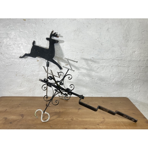 316 - A 19th century style wrought iron and steel weather vein with shaped metal deer top