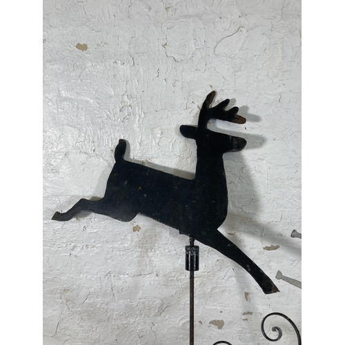 316 - A 19th century style wrought iron and steel weather vein with shaped metal deer top