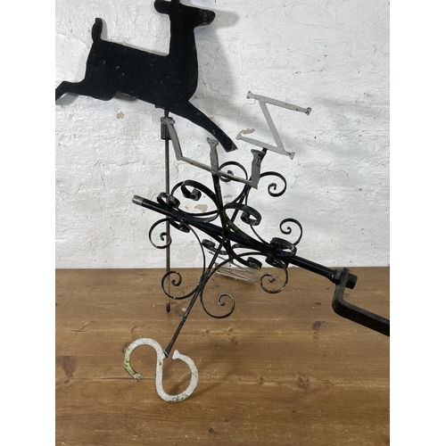 316 - A 19th century style wrought iron and steel weather vein with shaped metal deer top