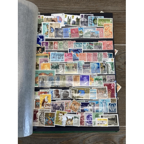 435 - Three stamp albums containing a collection of worldwide stamps