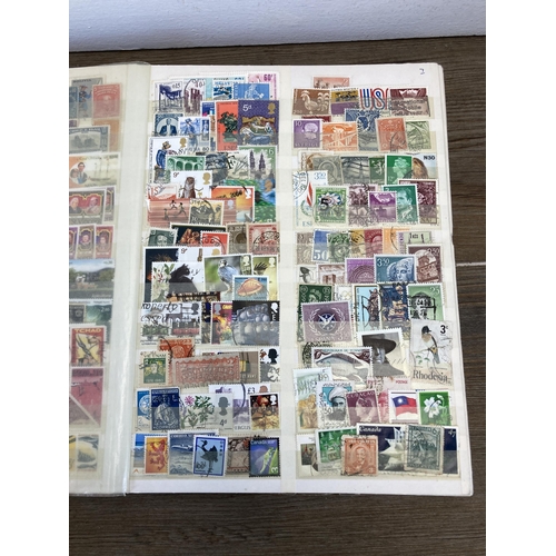 435 - Three stamp albums containing a collection of worldwide stamps