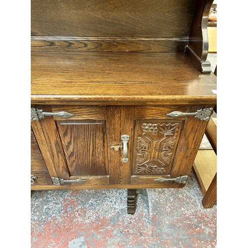 125 - A carved oak dresser - approx. 162cm high x 187cm wide x 43cm deep