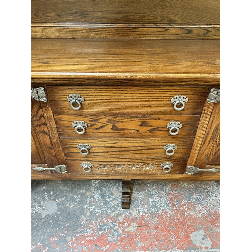 125 - A carved oak dresser - approx. 162cm high x 187cm wide x 43cm deep