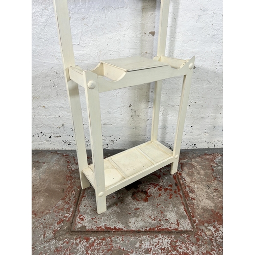 131 - An early 20th century white painted hallstand - approx. 181cm high x 70cm wide x 28cm deep