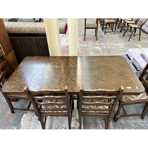 149 - An oak twin pedestal dining table and four chairs