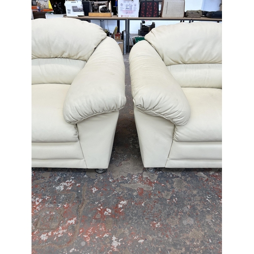 157 - A pair of Helvetia Furniture ivory leather armchairs