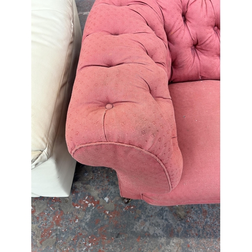 158 - A Victorian pink fabric button back upholstered sofa on turned mahogany supports and castors - appro... 