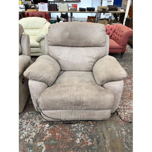 159 - A modern beige suede upholstered electric reclining two piece lounge suite comprising two seater sof... 