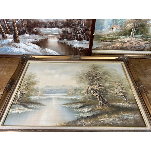 164 - Three framed oil paintings of lake and woodland scenes - largest approx. 75cm high x 110cm wide