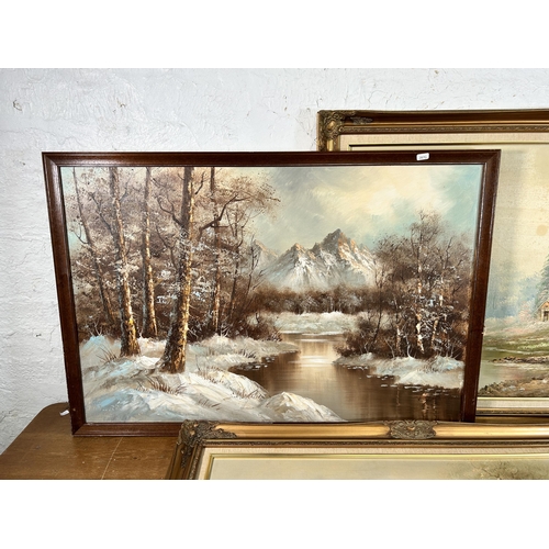 164 - Three framed oil paintings of lake and woodland scenes - largest approx. 75cm high x 110cm wide