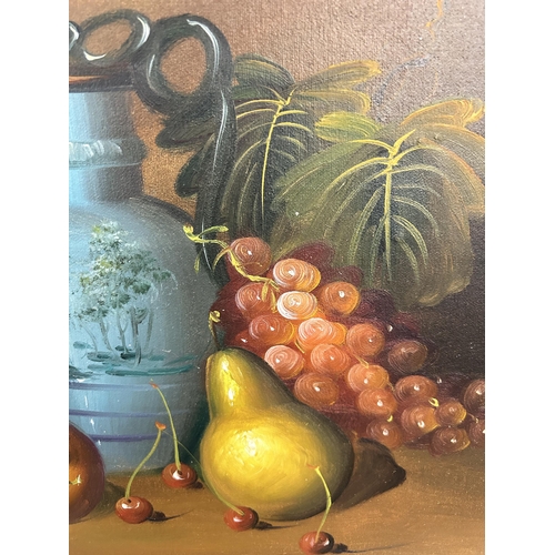 169 - A 20th century gilt framed fruit still life oil on canvas - approx. 42cm high x 52cm wide