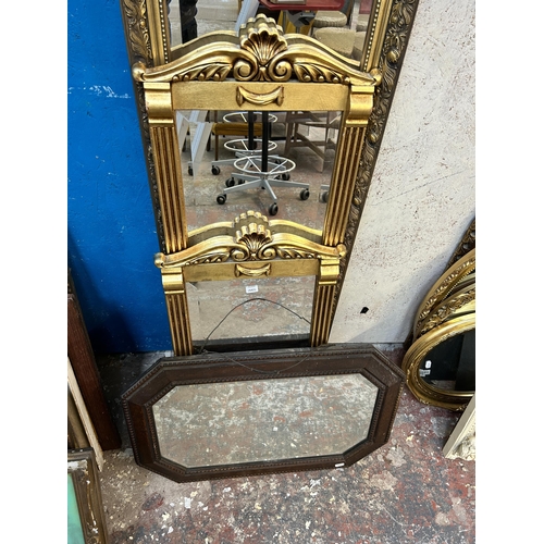 171 - Four framed bevelled edge wall mirrors, three gilt framed and one oak framed