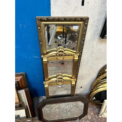 171 - Four framed bevelled edge wall mirrors, three gilt framed and one oak framed