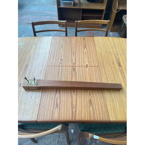 81B - A mid 20th century teak extending dining table and five chairs - approx. 74cm high x 92cm wide x 198... 