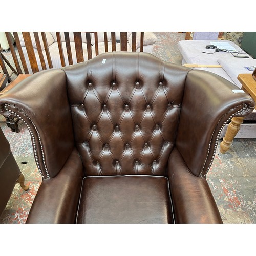 151 - A Buffalo brown leather Chesterfield wingback armchair on cabriole supports - approx. 103cm high x 9... 