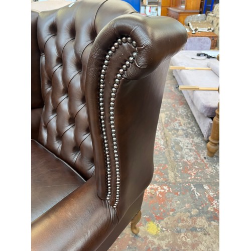 151 - A Buffalo brown leather Chesterfield wingback armchair on cabriole supports - approx. 103cm high x 9... 