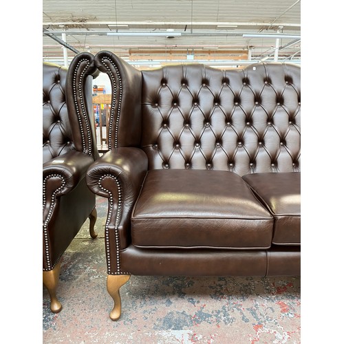 151A - A Buffalo brown leather Chesterfield wingback three seater sofa on cabriole supports - approx. 105cm... 