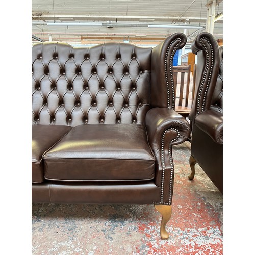 151A - A Buffalo brown leather Chesterfield wingback three seater sofa on cabriole supports - approx. 105cm... 