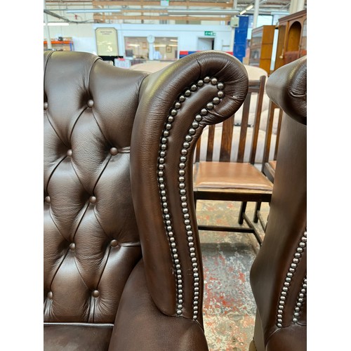 151A - A Buffalo brown leather Chesterfield wingback three seater sofa on cabriole supports - approx. 105cm... 