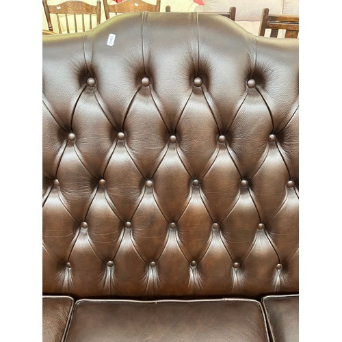 151A - A Buffalo brown leather Chesterfield wingback three seater sofa on cabriole supports - approx. 105cm... 