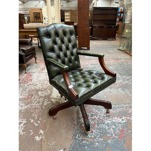 151D - A green leather and mahogany Chesterfield swivel office desk chair - approx. 96cm high x 61cm wide x... 