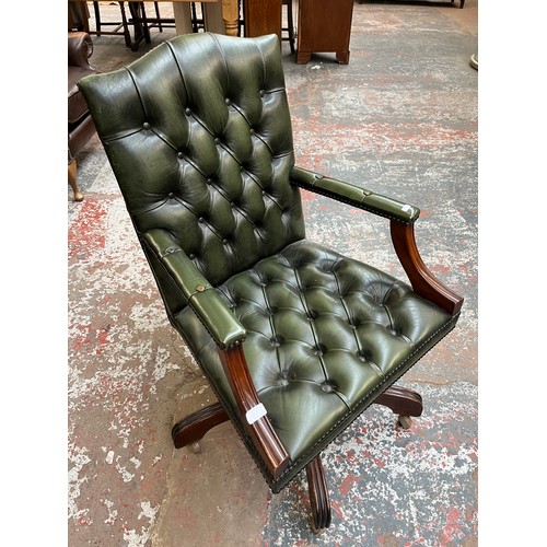 151D - A green leather and mahogany Chesterfield swivel office desk chair - approx. 96cm high x 61cm wide x... 