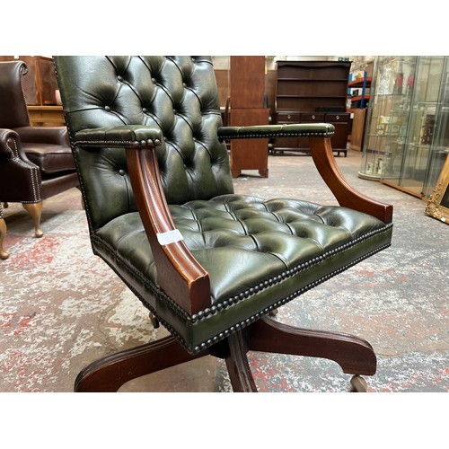 151D - A green leather and mahogany Chesterfield swivel office desk chair - approx. 96cm high x 61cm wide x... 